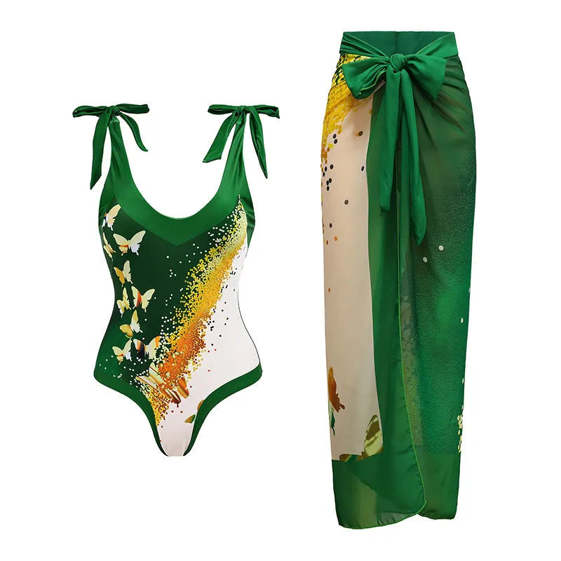 Women's solid colour one-piece swimsuit with spaghetti straps and a detachable skirt.