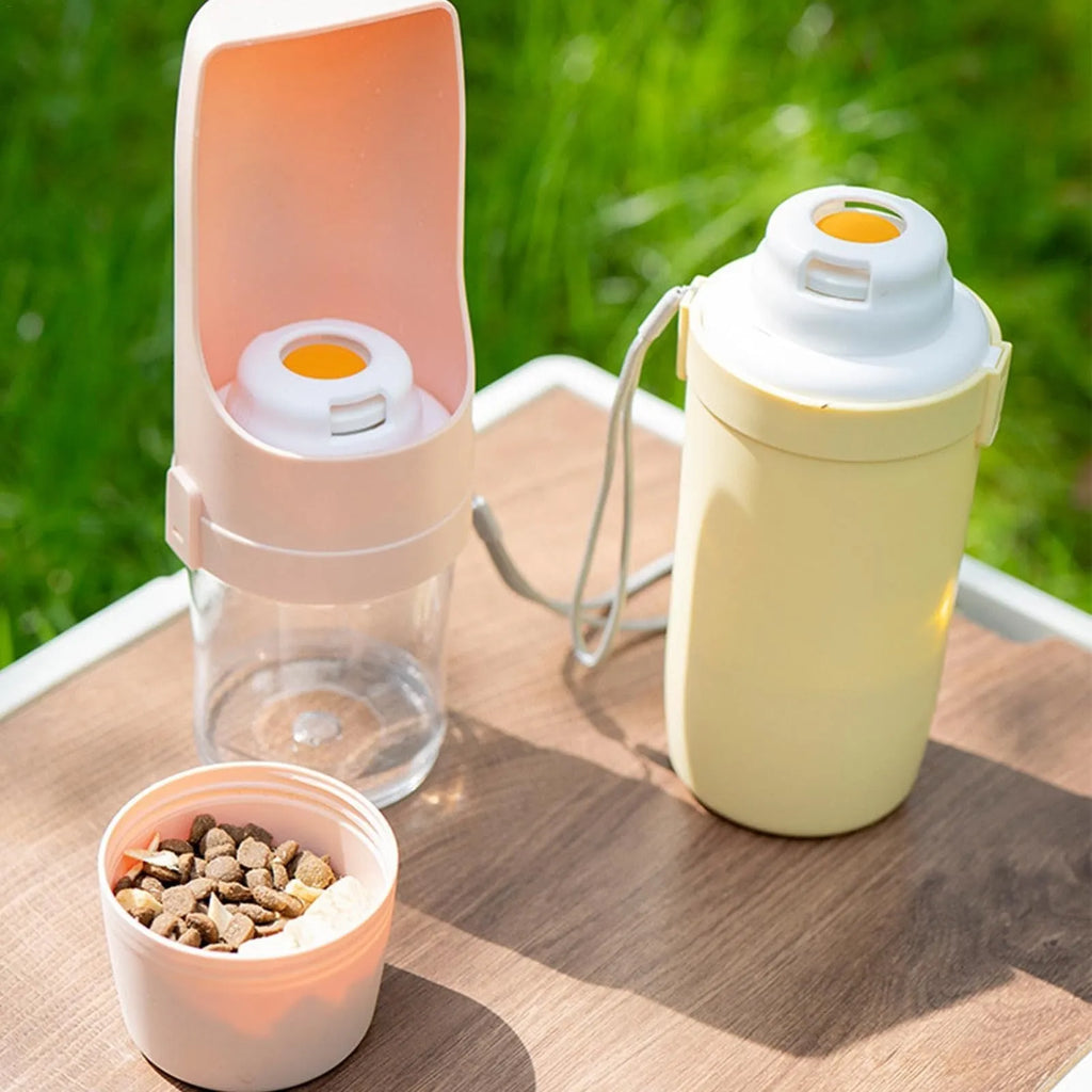 Green 2-in-1 travel dog water bottle and feeder with lanyard, showing folded size.