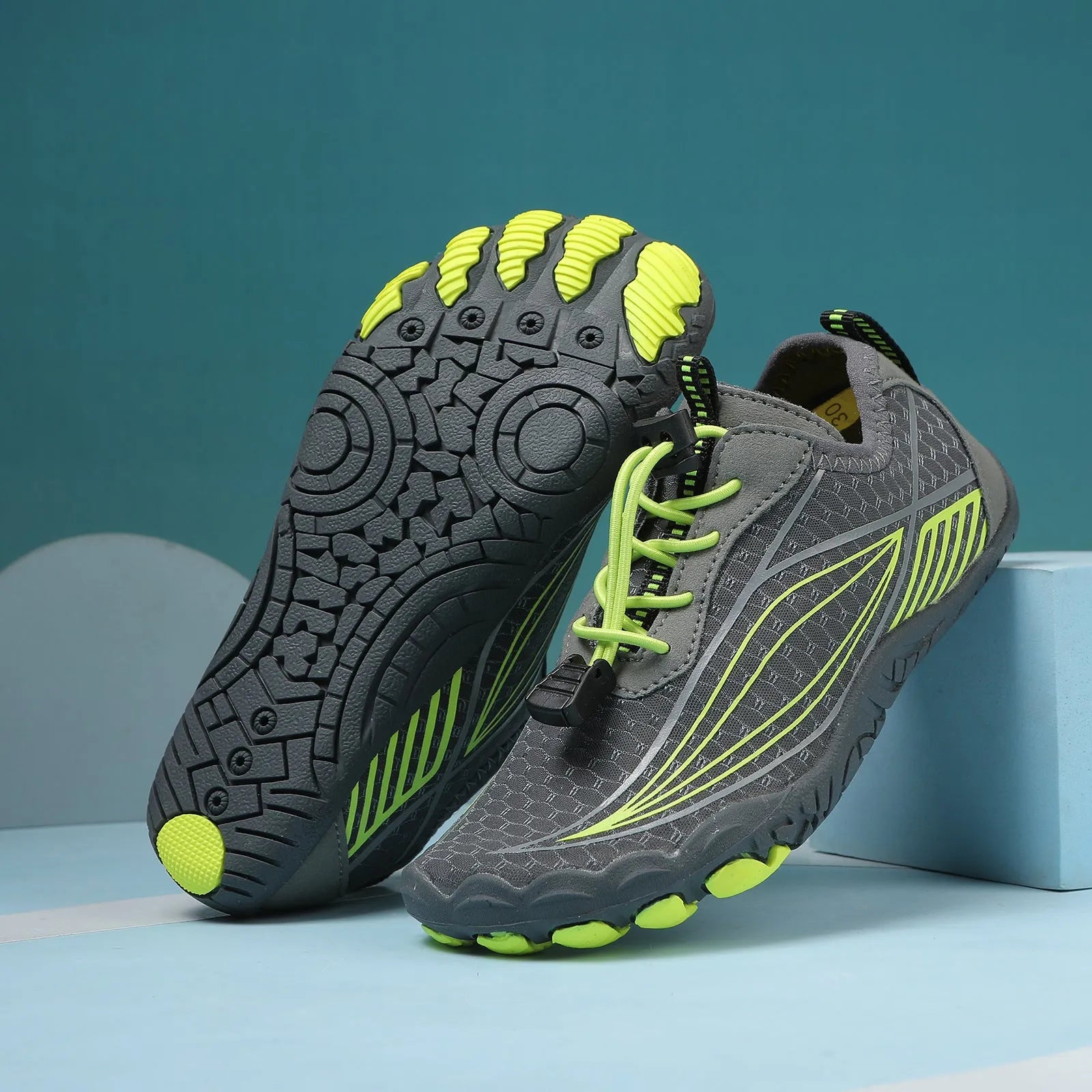 Children's black quick-drying water shoes with a non-slip rubber sole and elastic band.