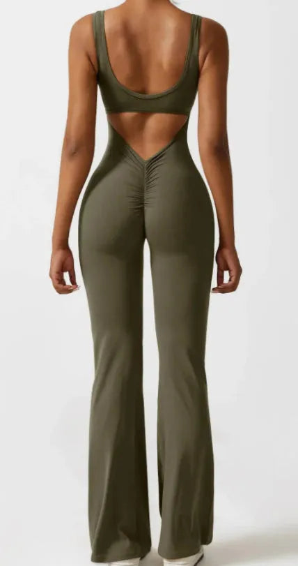 Women's black milk silk yoga bodysuit with hollow back and seamless construction on a mannequin.