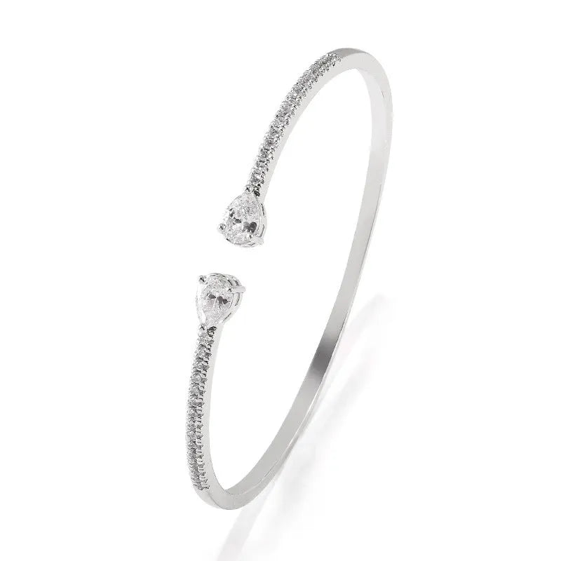 Copper bracelet with inlaid zircon treatment in blue and white colour options