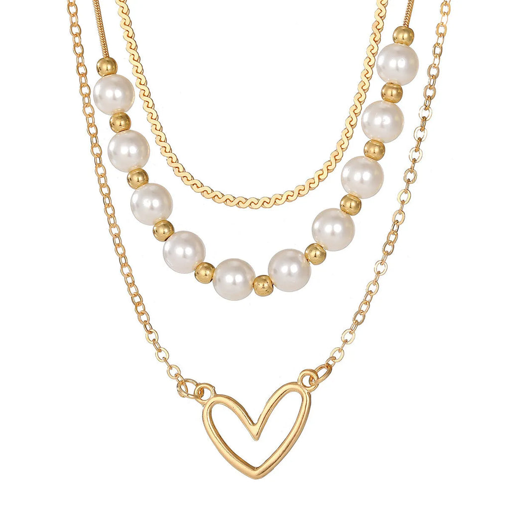 Vintage gold-tone heart pendant necklace with pearl chain and adjustable length