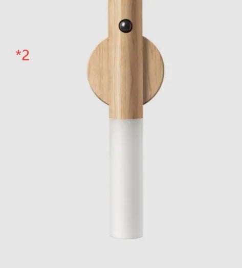 Smart sensor LED desk lamp in wood and acrylic glass on a desk.