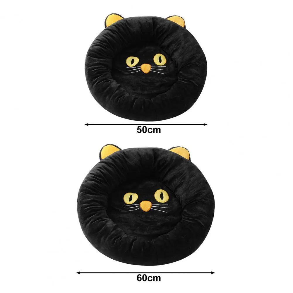 Black cat shape velvet pet nest bed with raised edges, 50cm diameter, on floor