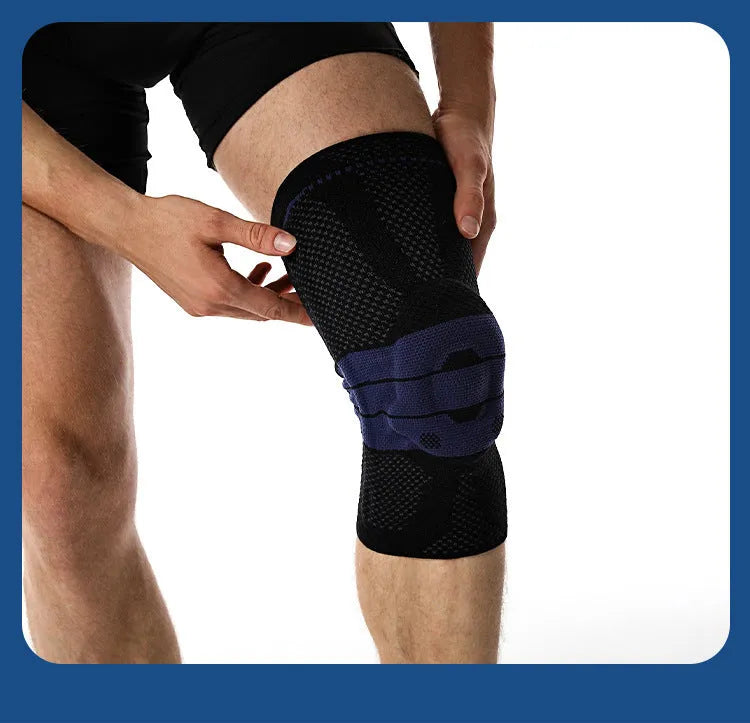 A pair of adult sports kneecaps in nylon and spandex, shown in black and blue colour, for knee protection.