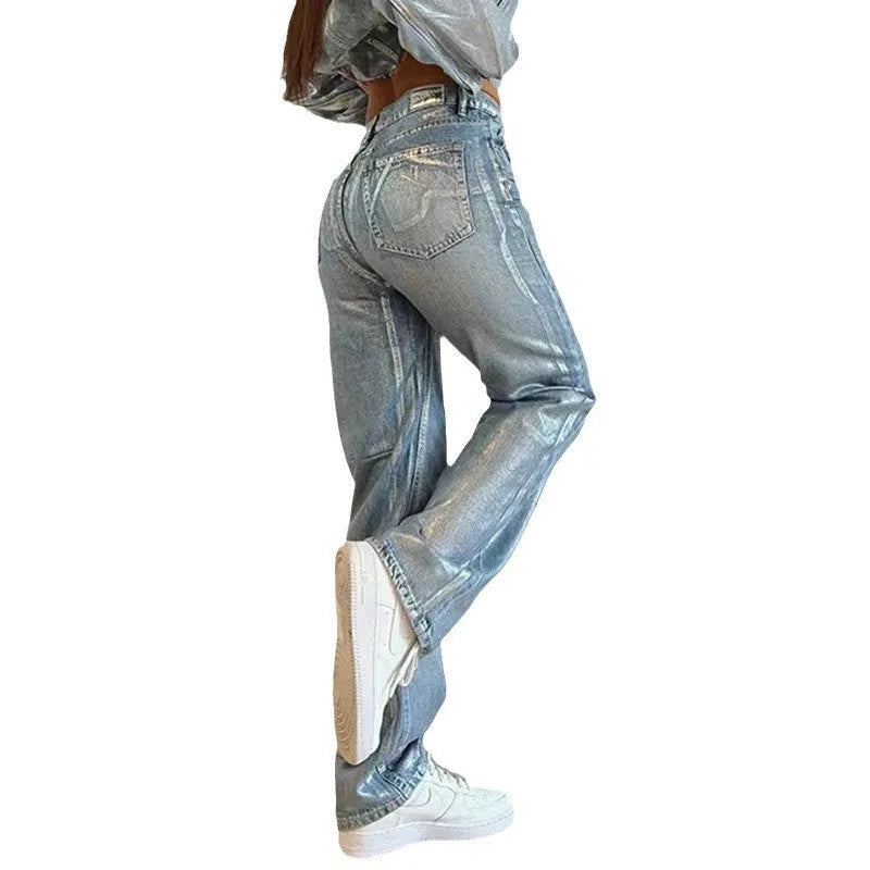 Women's high waist straight leg jeans in washed blue denim with silver contrast details