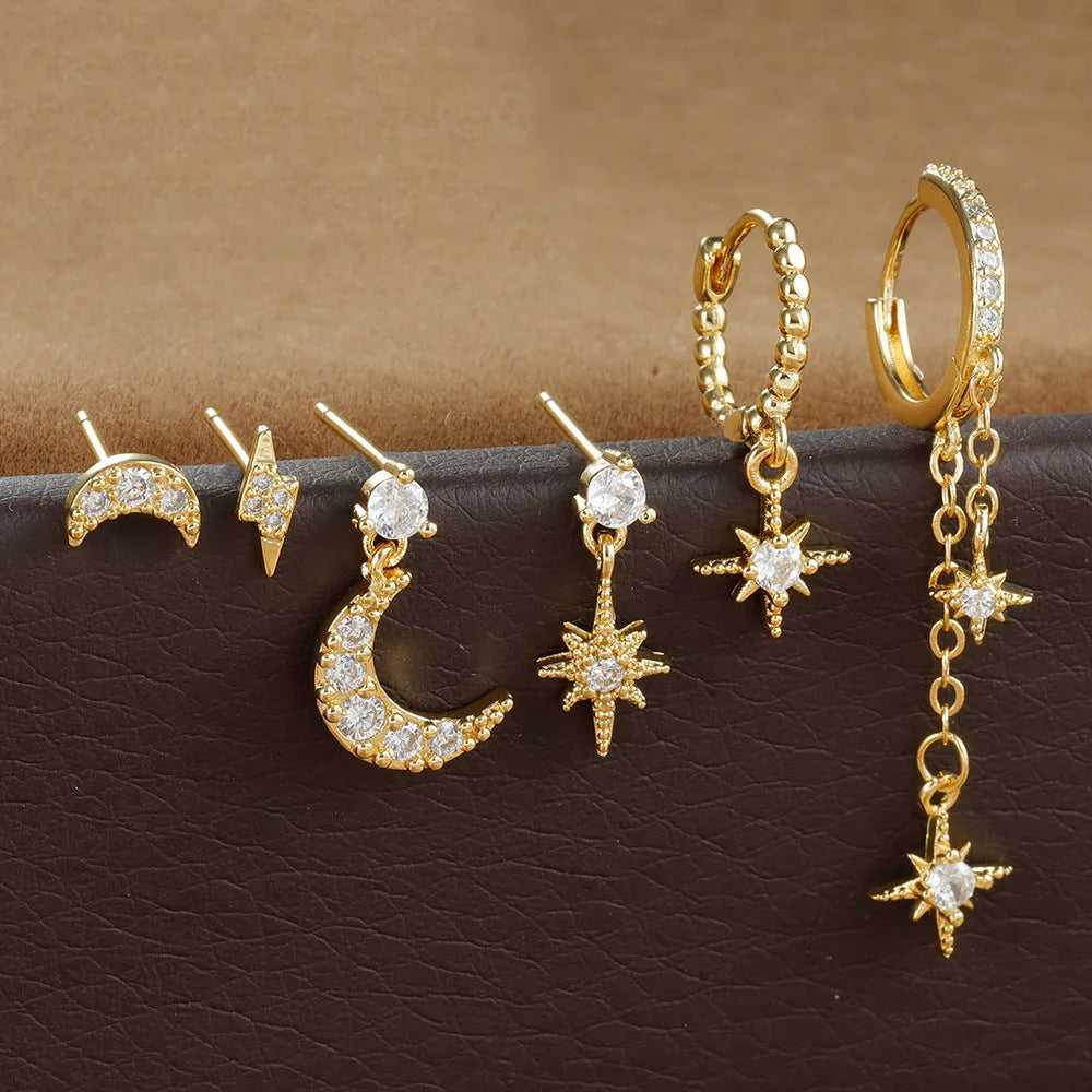 Set of six gold-coloured XINGX women's earrings with zircon studs and chain tassels.