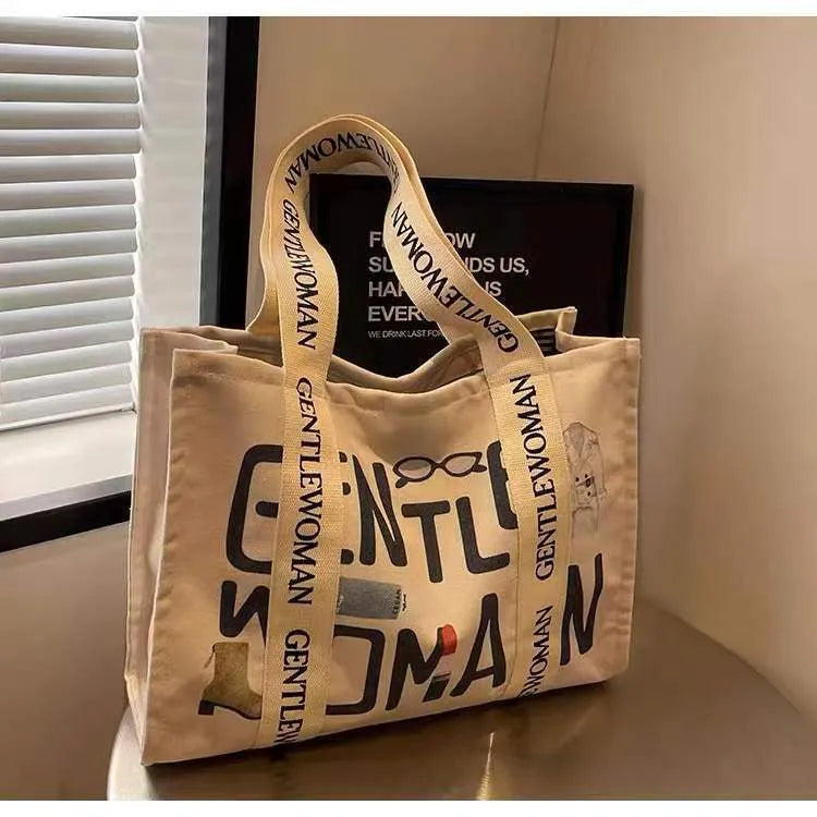 Large canvas tote bag with printed design, shown in multiple colour and pattern options.