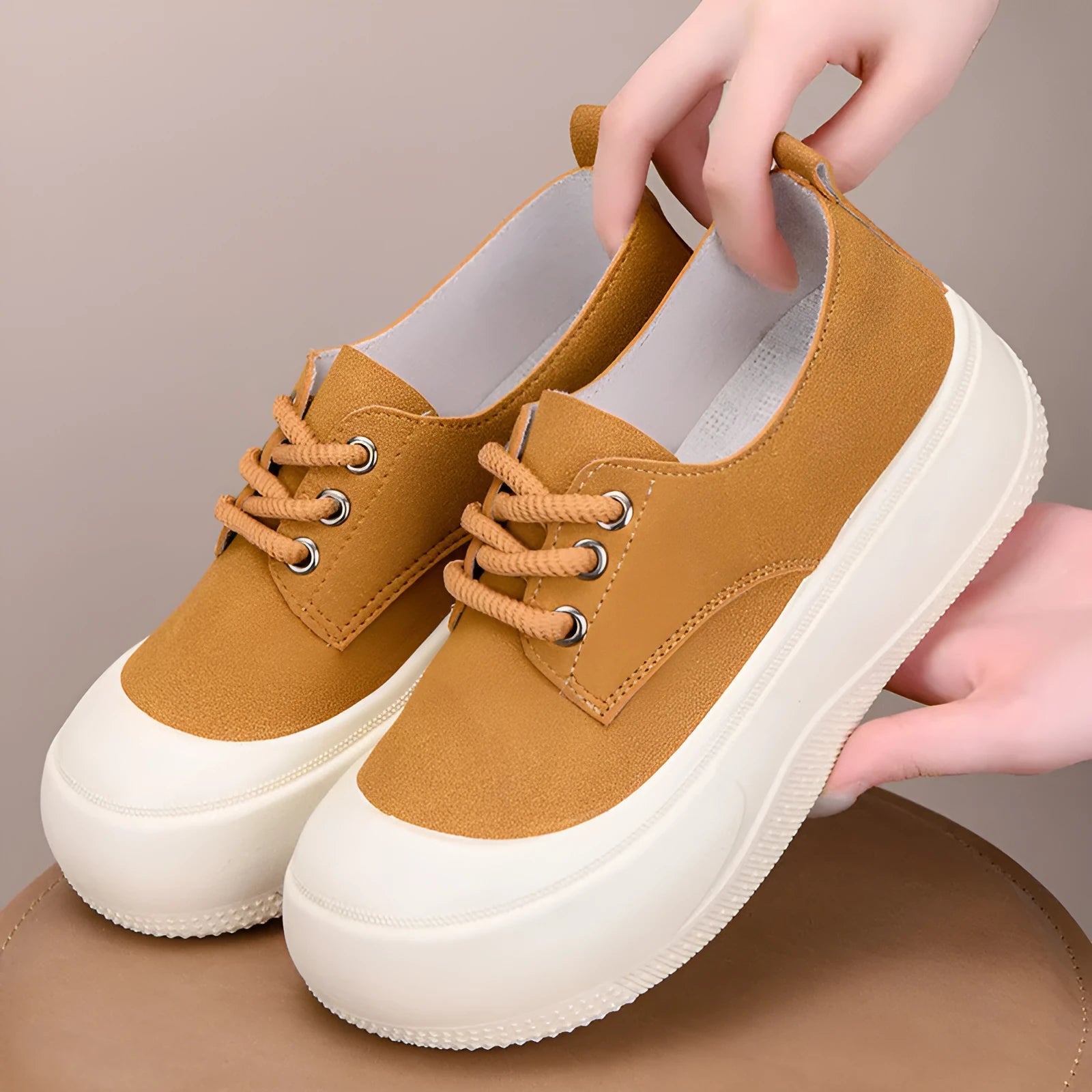 Women's camel suede platform loafers with 4cm heel, round toe, and front lace-up on a rubber sole.