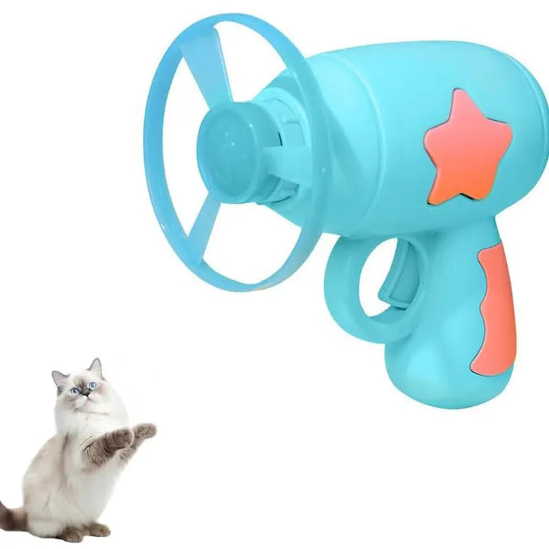 Blue interactive cat toy gun with plastic frisbee mounted ready for launching