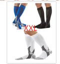 Graduated compression socks for men and women in black, shown laid flat.