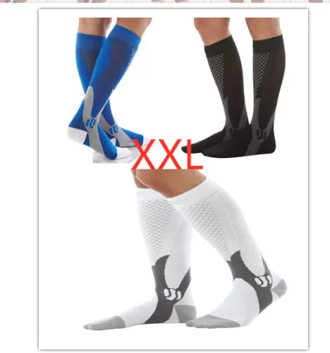 Graduated compression socks for men and women in black, shown laid flat.