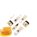 Seven-piece skin care set showing facial cleanser, face cream, lip balm, barrier cream, body lotion, facial scrub and beef tallow balm