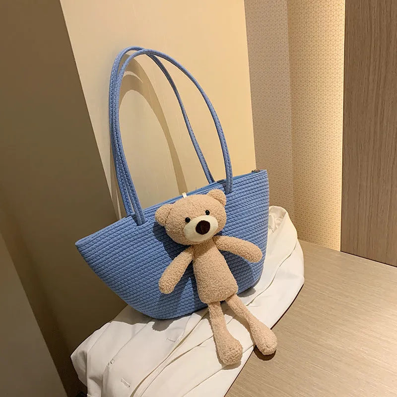 Cotton and linen woven shoulder bag in dumpling shape with three-dimensional pocket and double straps