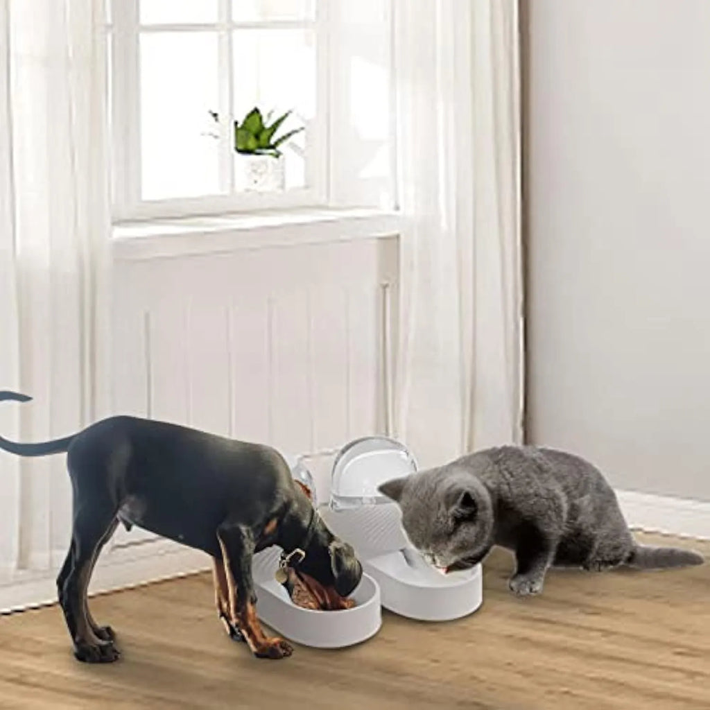 White automatic cat feeder and water dispenser set with wave-shaped design on a floor.