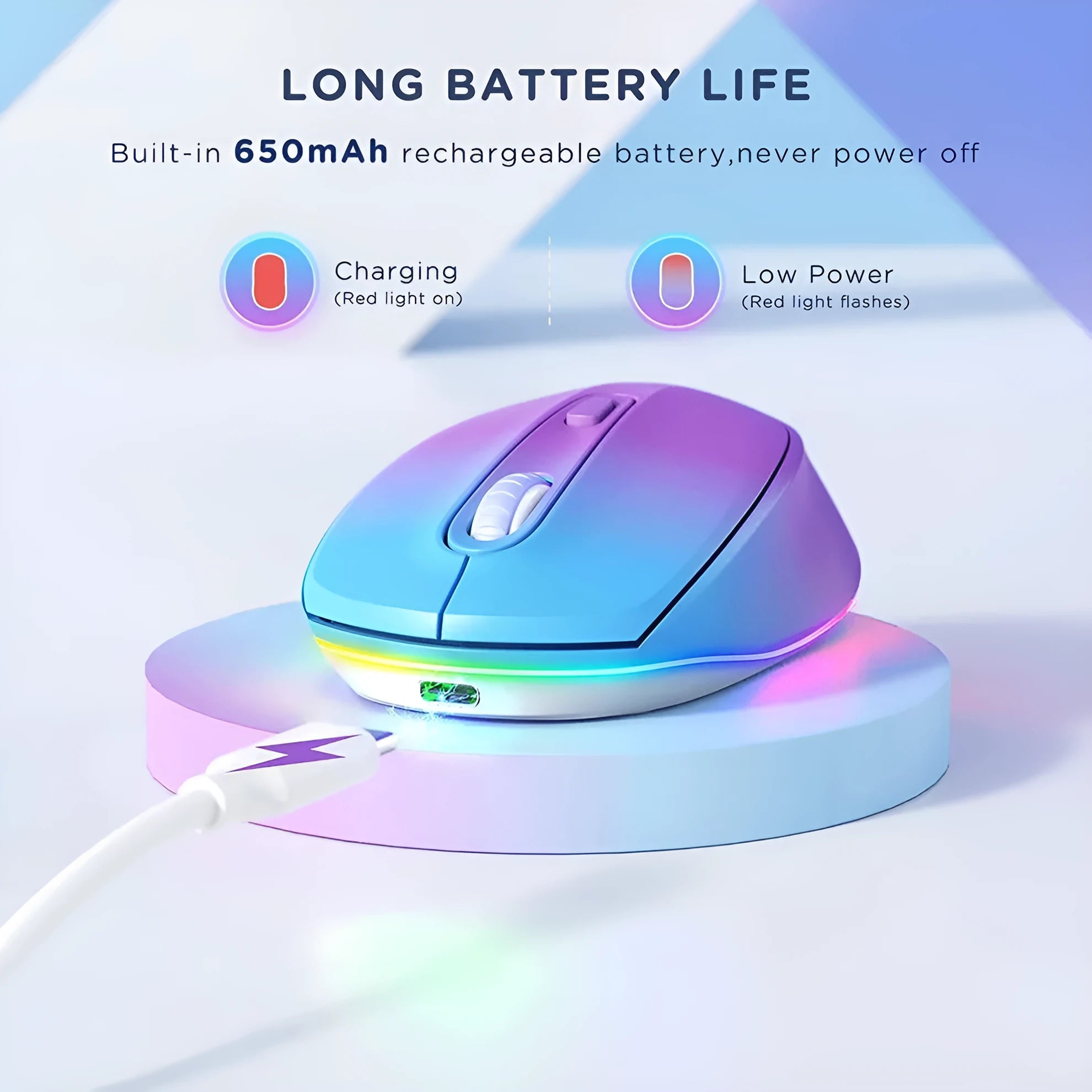 Light grey wireless computer mouse with USB charging cable on wooden desk