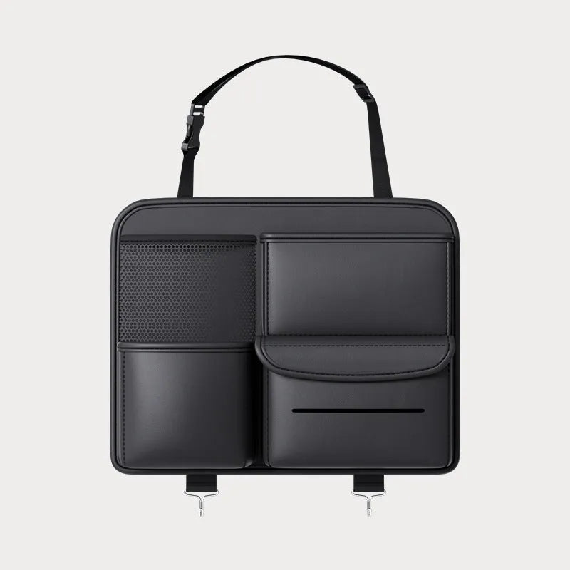Black leather car seat back hanging storage bag with carrying handle shown in vehicle