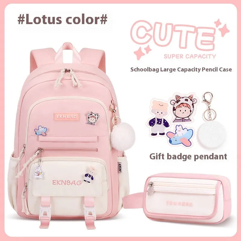 Pink waterproof Oxford cloth school backpack for girls with curved shoulder straps on a white background.