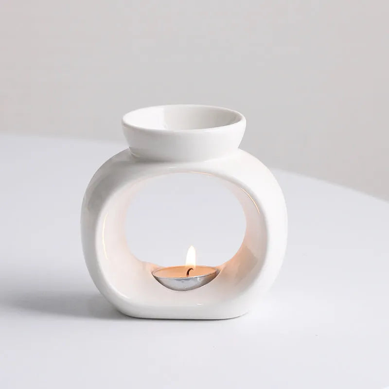 White ceramic Nordic style aromatherapy stove ornament with retro domestic design on tabletop
