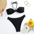 Black women's bikini set with lace-up tube top and matching briefs on swimwear hanger