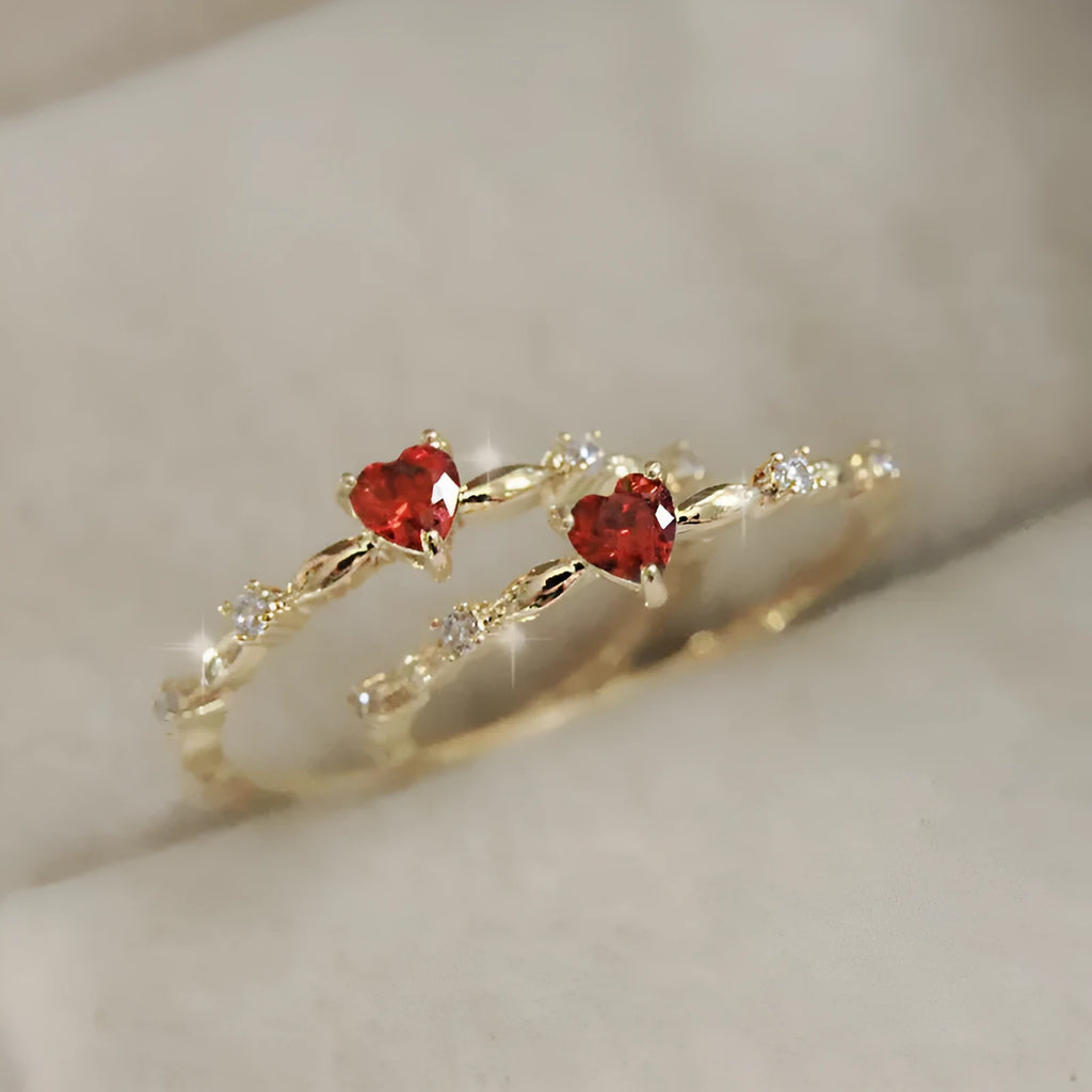Gold and silver electroplated fashion ring with a peach heart charm and zircon stone.