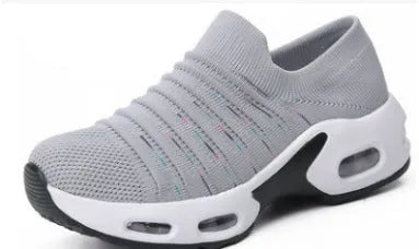 Women's stretch knitted sock shoes in various colours showing mesh upper and round toe design.