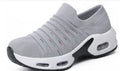 Women's stretch knitted sock shoes in various colours showing mesh upper and round toe design.