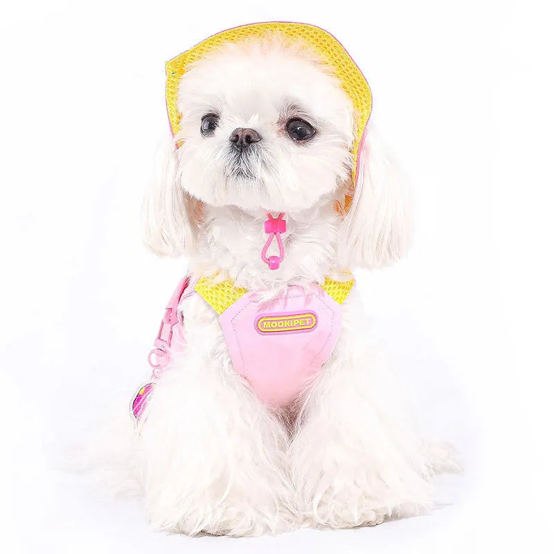 Pink adjustable traction vest on a small dog, showing the fit and fastening.