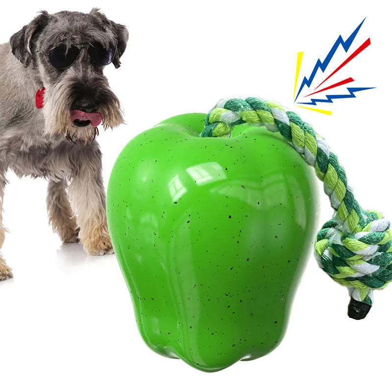 Green apple-shaped plastic dog chew toy with food slot and stem details
