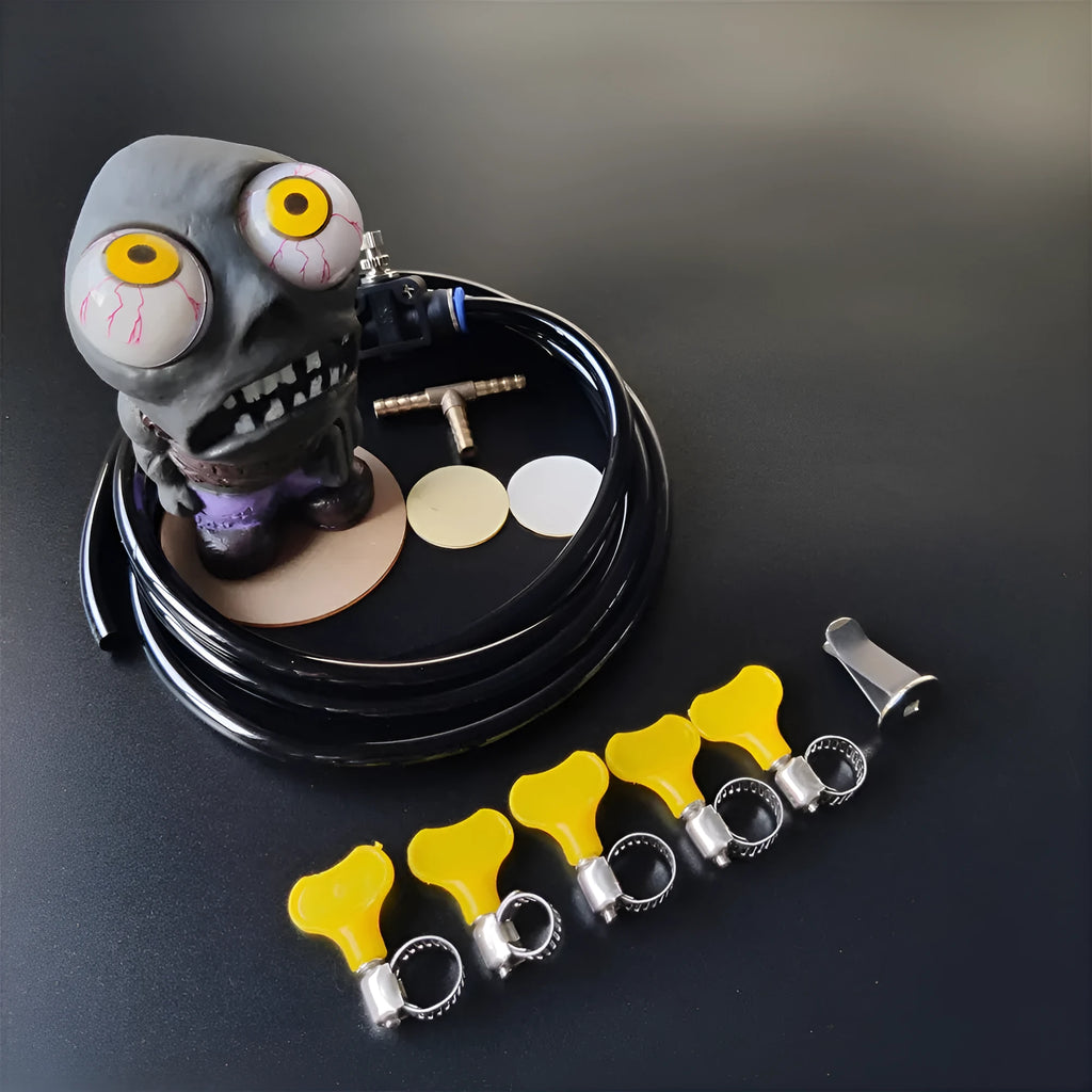Turbo car decompress ornament kit showing rubber doll, copper three-way tube, pressure valve, and PU tubing on a white background.