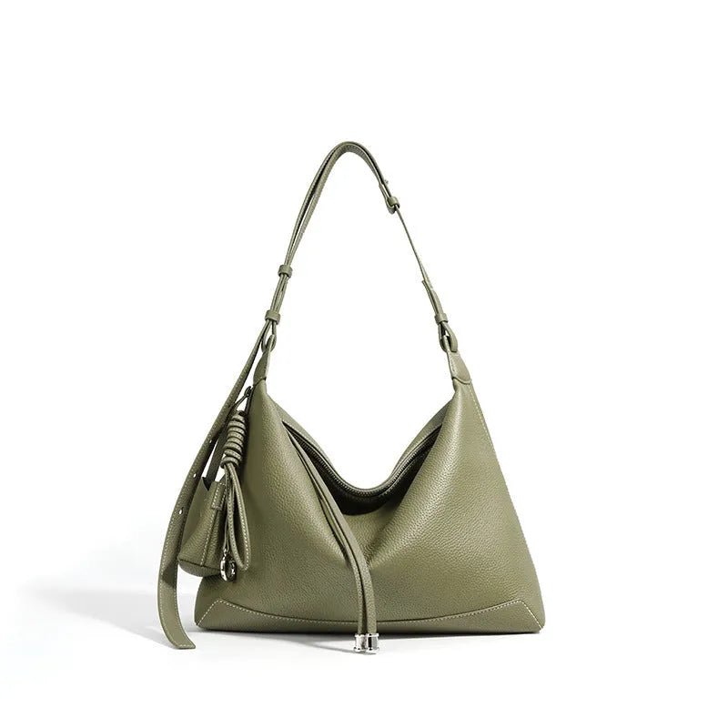 Full-grain leather women's crossbody bag in biscuit with spliced design and zip closure