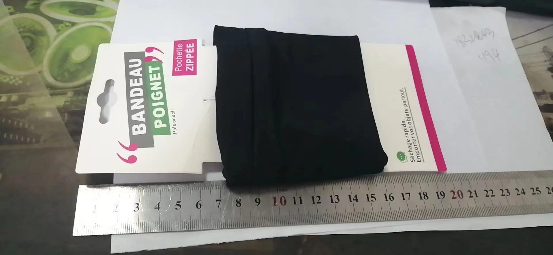Wrist bag armband sleeve for mobile phone measuring 10 by 10.5 centimetres.