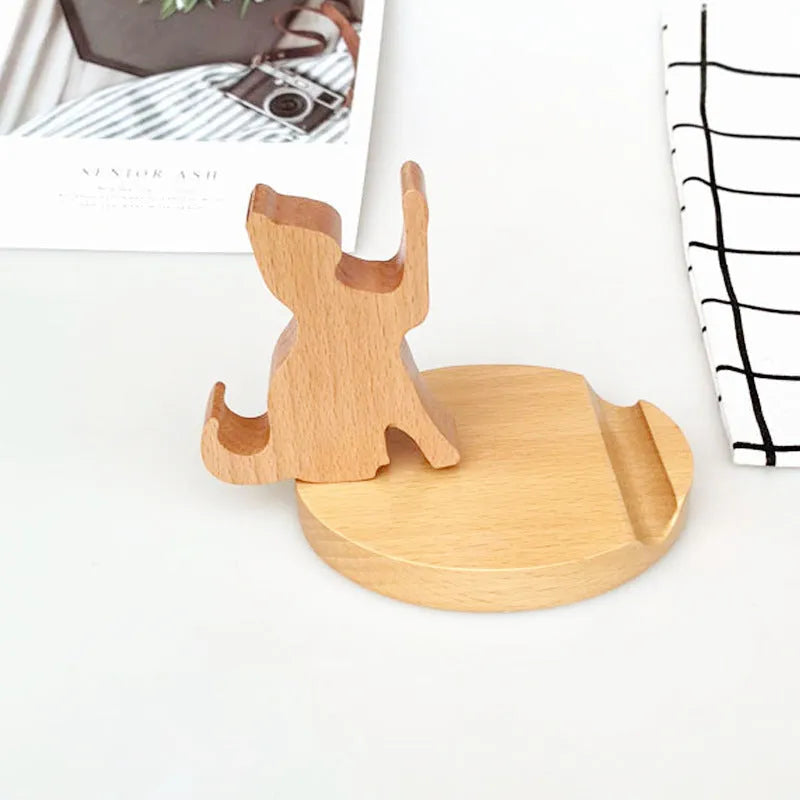 Beech wood mobile phone holder stand with coin slot and decorative carving.