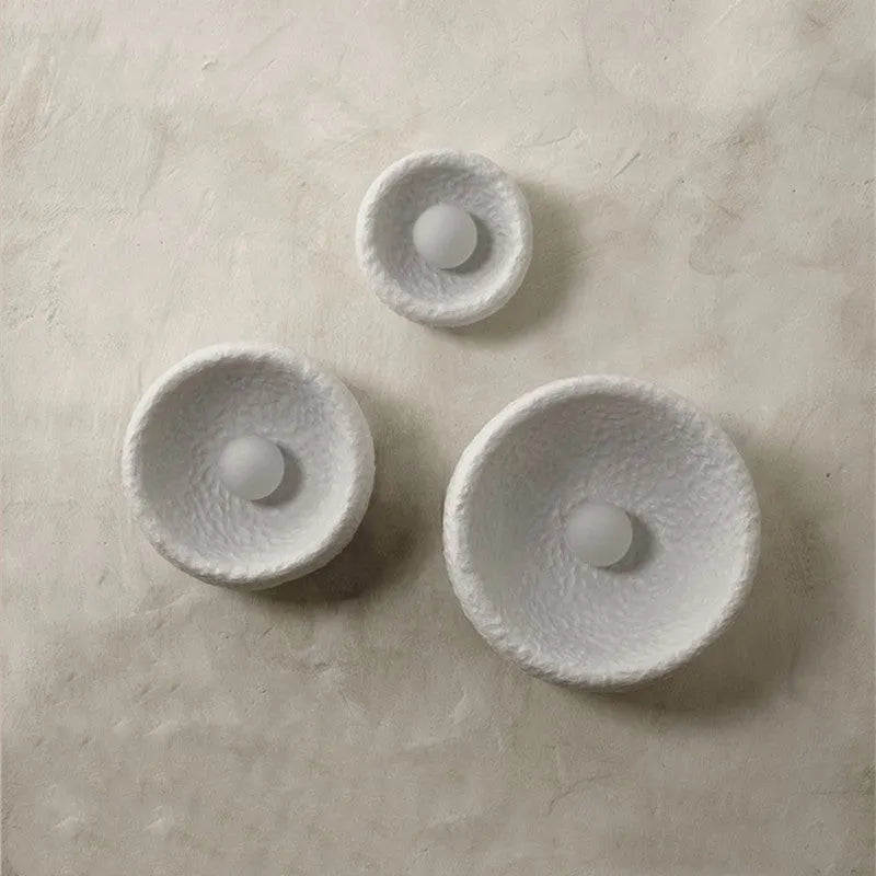 Japanese-style simple modern wall lamp with round resin shade in warm light