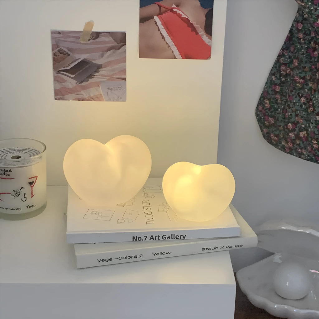 White and pink vinyl atmosphere lamps glowing warmly, shown in small and large size options.