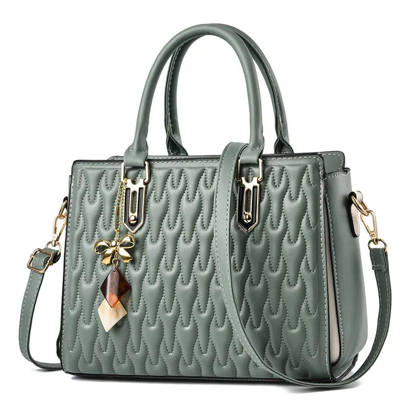 Women's messenger shoulder bag in gold colour showing outer pocket sandwich design and organised interior compartments