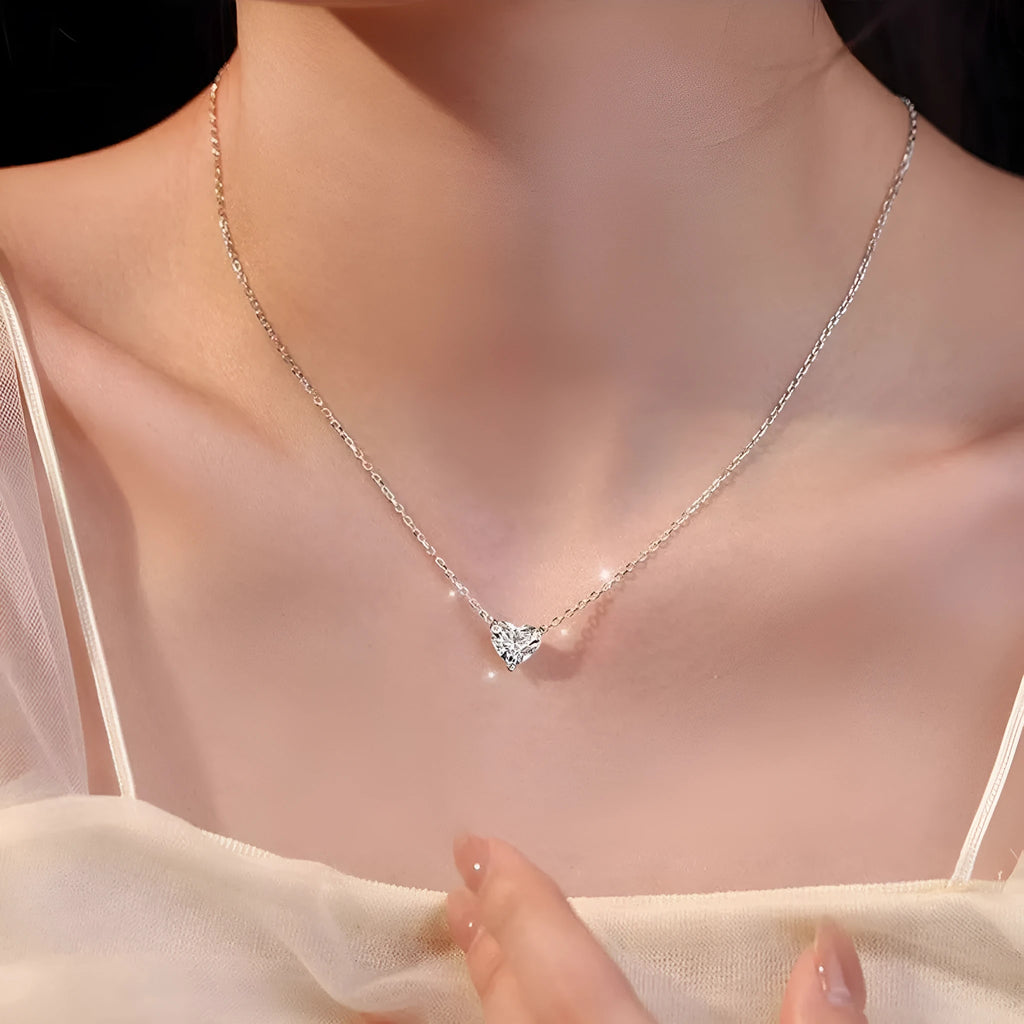 Silver-coloured copper love heart pendant necklace for women on a 16-inch chain.