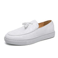 Men's black business casual sneakers with tassel detail on artificial PU leather upper