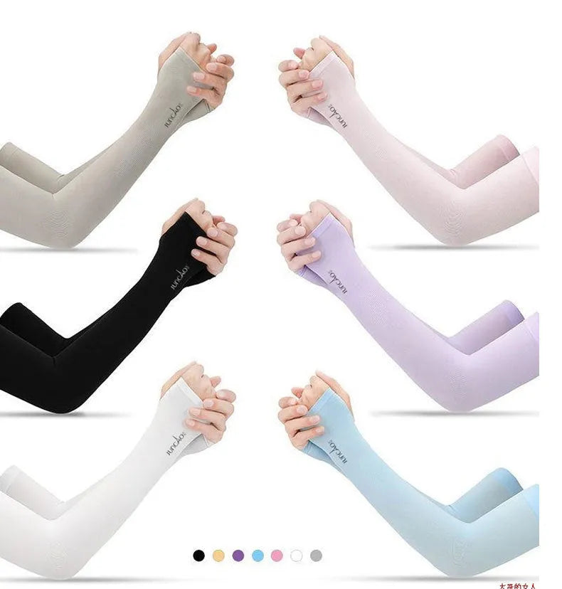 A person wearing a grey sun protection driving sleeve on their forearm, showing the open finger design.