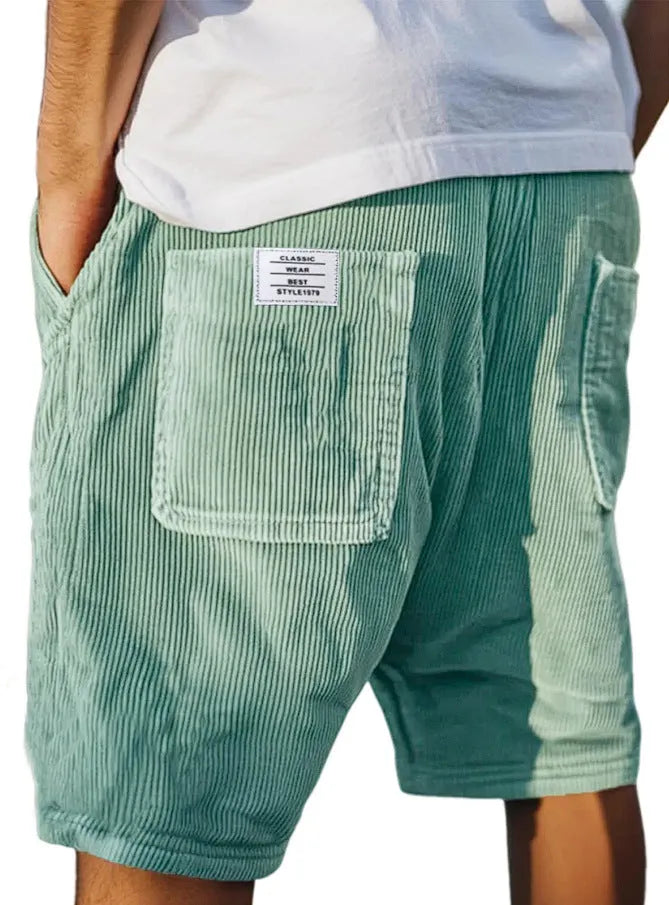 Men's grey corduroy shorts with multiple pockets and straight-leg cut on a neutral background.