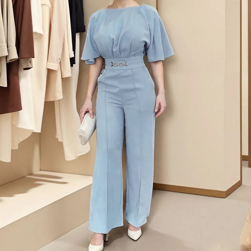 Blue polyester men's two-piece suit with long-sleeved jacket and trousers on hanger