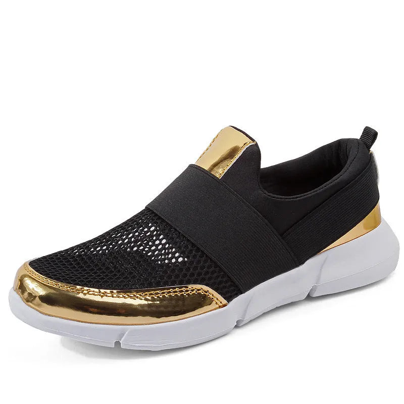 Low-cut blue women's casual sneakers with mesh upper on a hard floor surface.