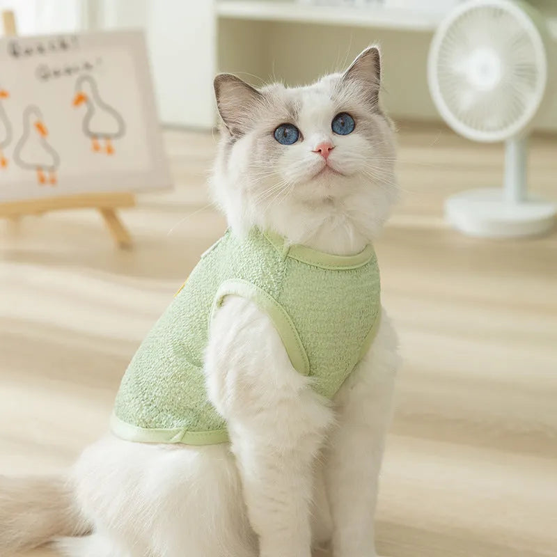 Green knitted cat top with hollowed-out design and a bear cartoon patch on the side