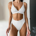 Women's grey bikini set with contrast binding and embroidery detailing, sleeveless with shorts