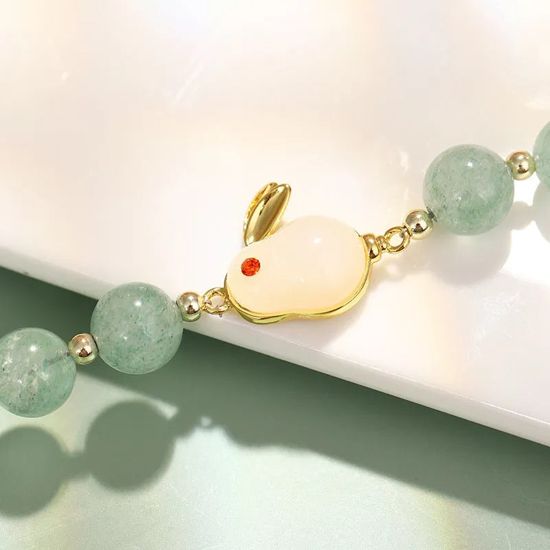 Rabbit charm bracelet with green aventurine or strawberry quartz stones on gold-plated copper