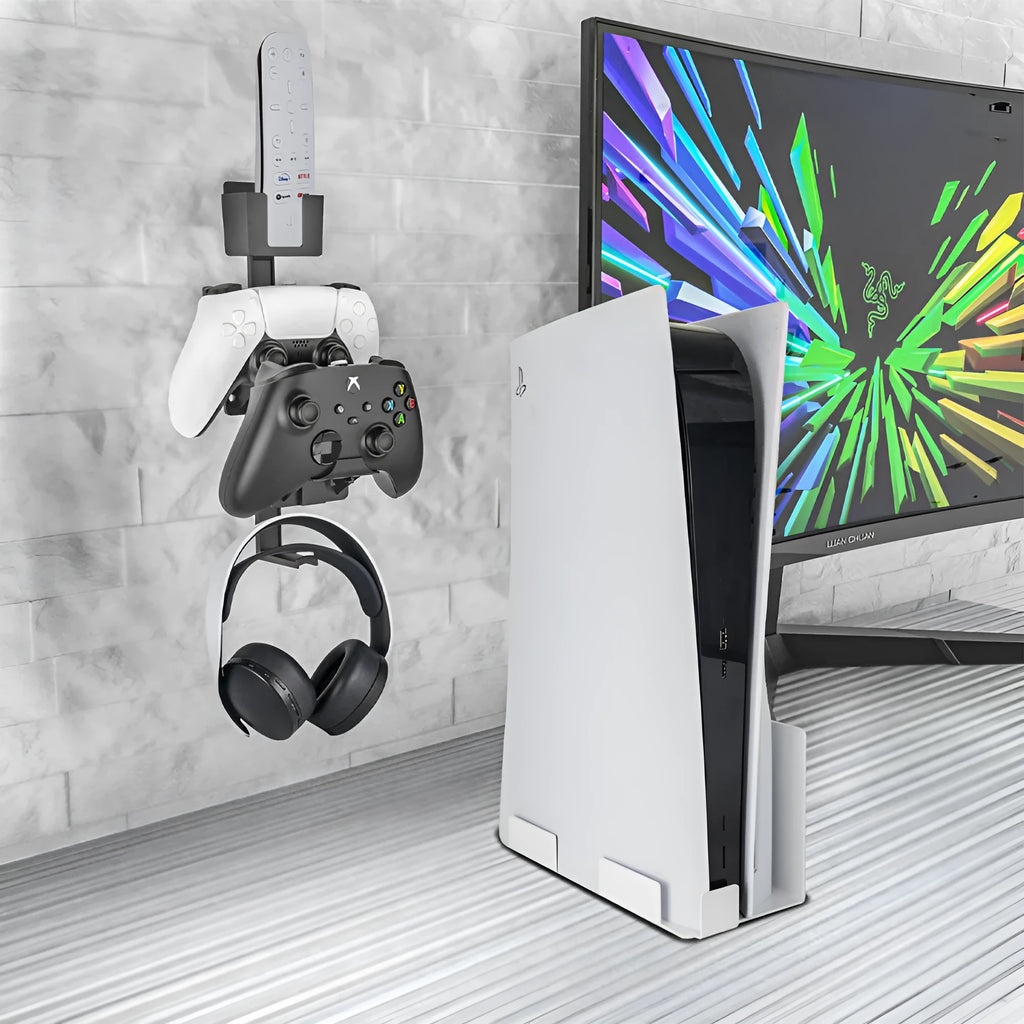 White wall-mounted plastic hook holding a PS5 controller and a gaming headset.