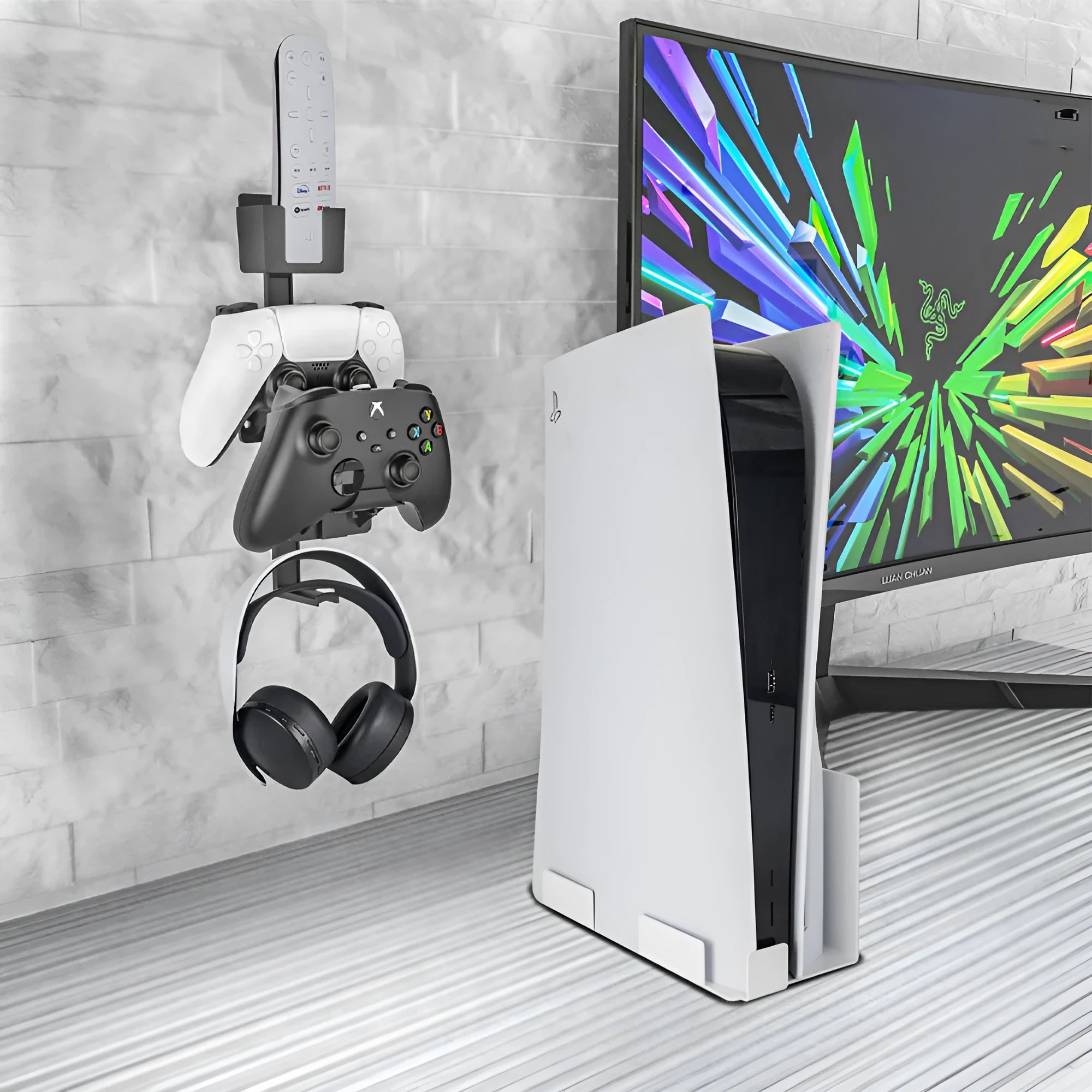 White wall-mounted plastic hook holding a PS5 controller and a gaming headset.