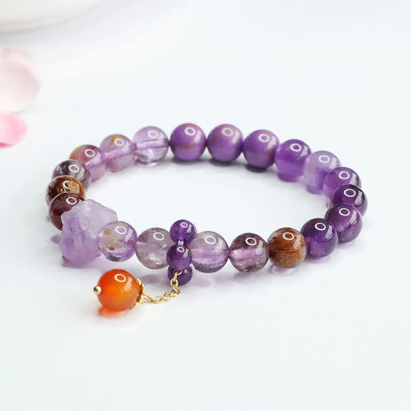 Purple amethyst crystal bracelet with red agate stones measuring 8mm beads
