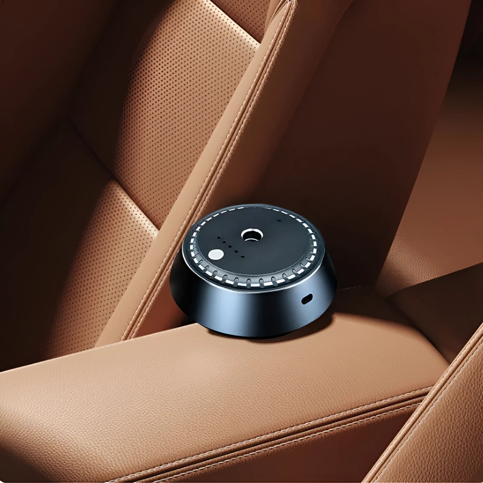 Black metal car aroma diffuser measuring 9cm by 4.5cm with USB charging port