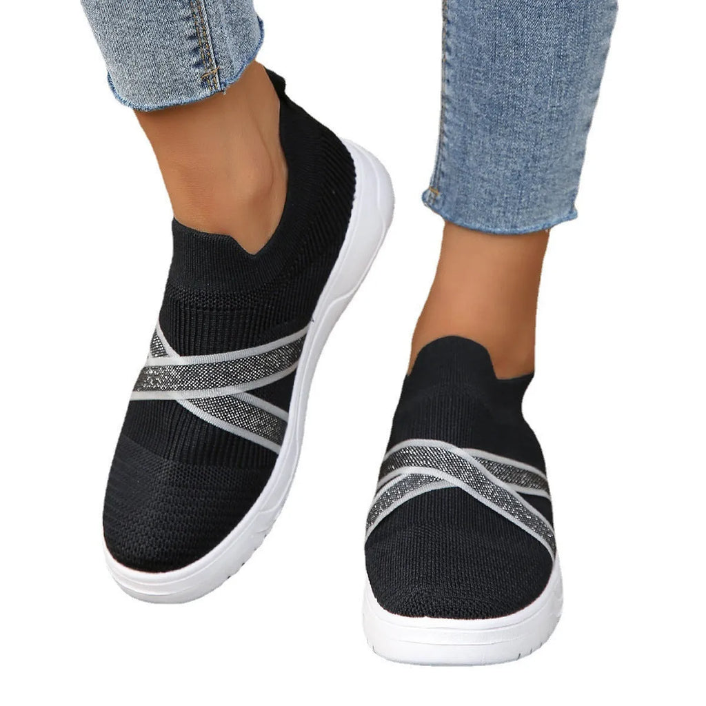 Black women's flat mesh shoes with flyknit fabric upper and tassel detail